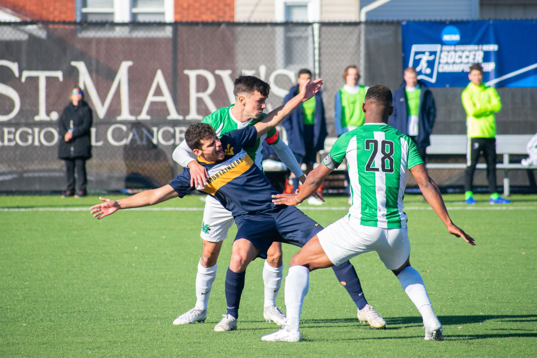 West Virginia forward Rodrigo Robles Grajera gets pushed down by a Marshall defender in the second round of the NCAA Tournament at Hoops Family Field on Nov. 24, 2019.
